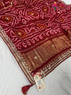 pallu detailing of red gajji silk bandhani saree