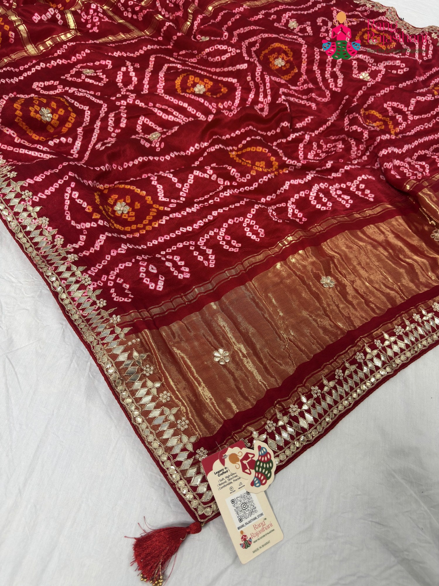 pallu detailing of red gajji silk bandhani saree