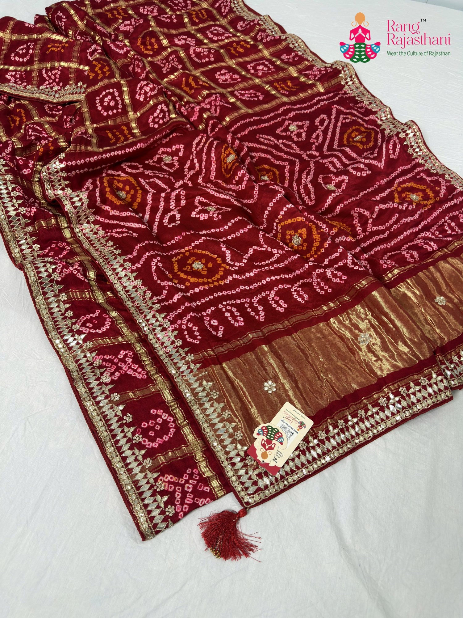 close up detailing of red gajji silk bandhani saree