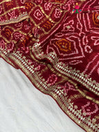 border detailing of red gajji silk bandhani saree