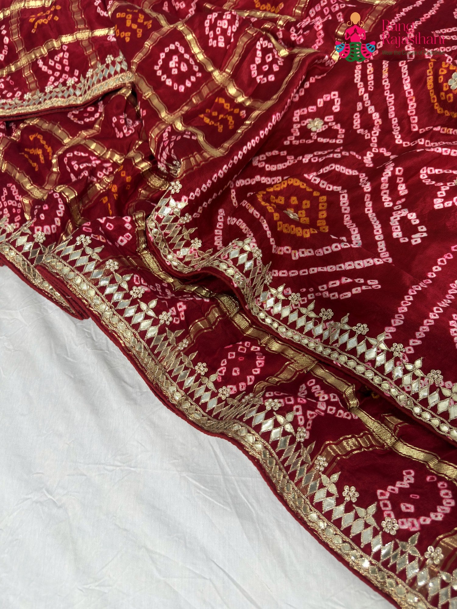 border detailing of red gajji silk bandhani saree