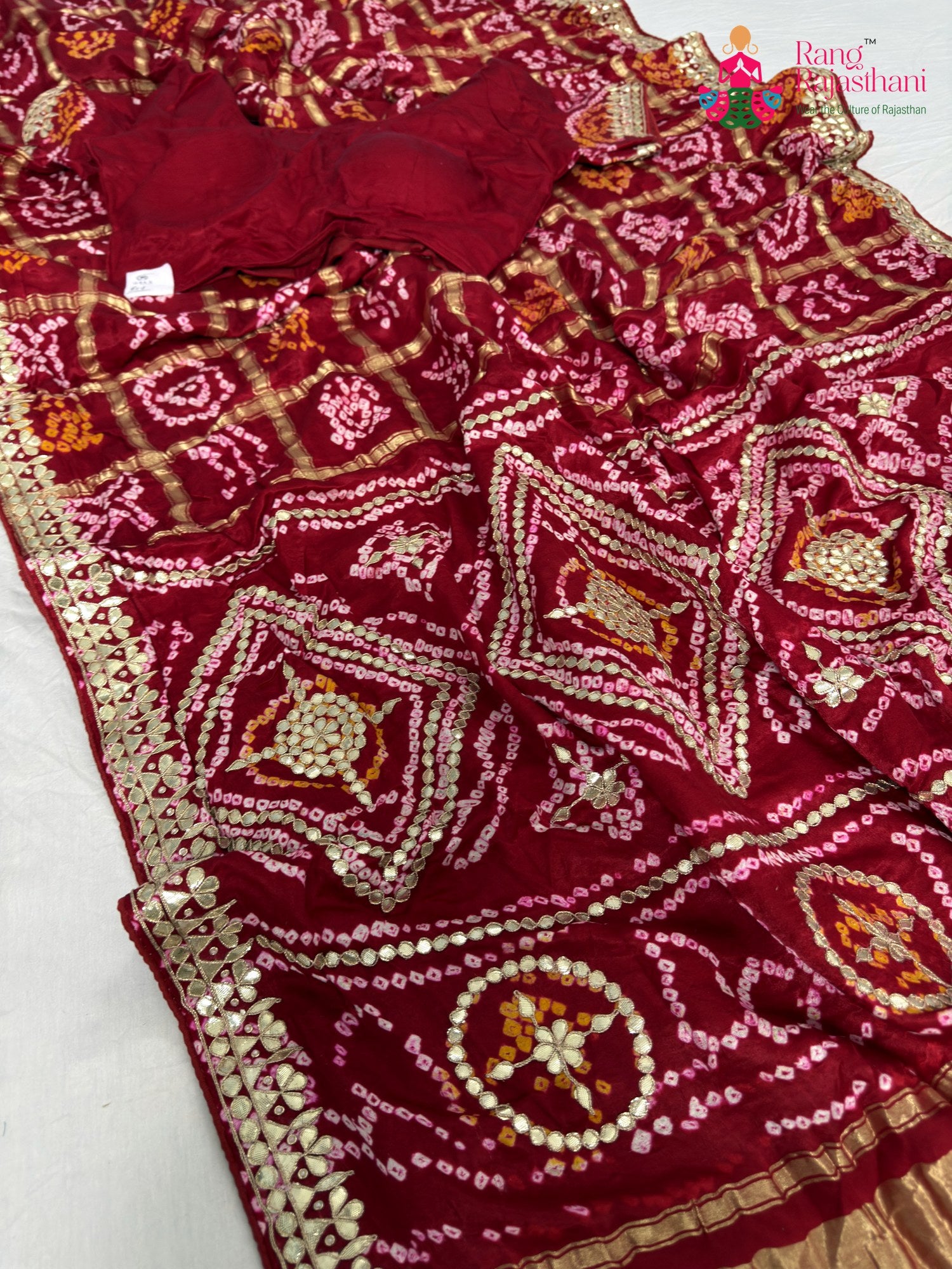 close up detailing of red gajji silk gota patti saree