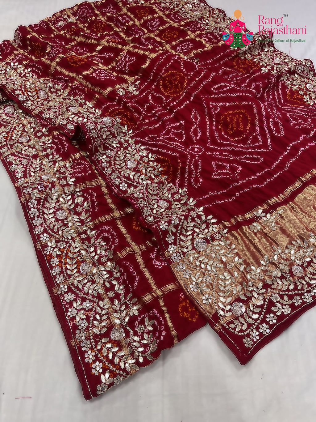 close up detailing of red gajji silk hand embellishment saree