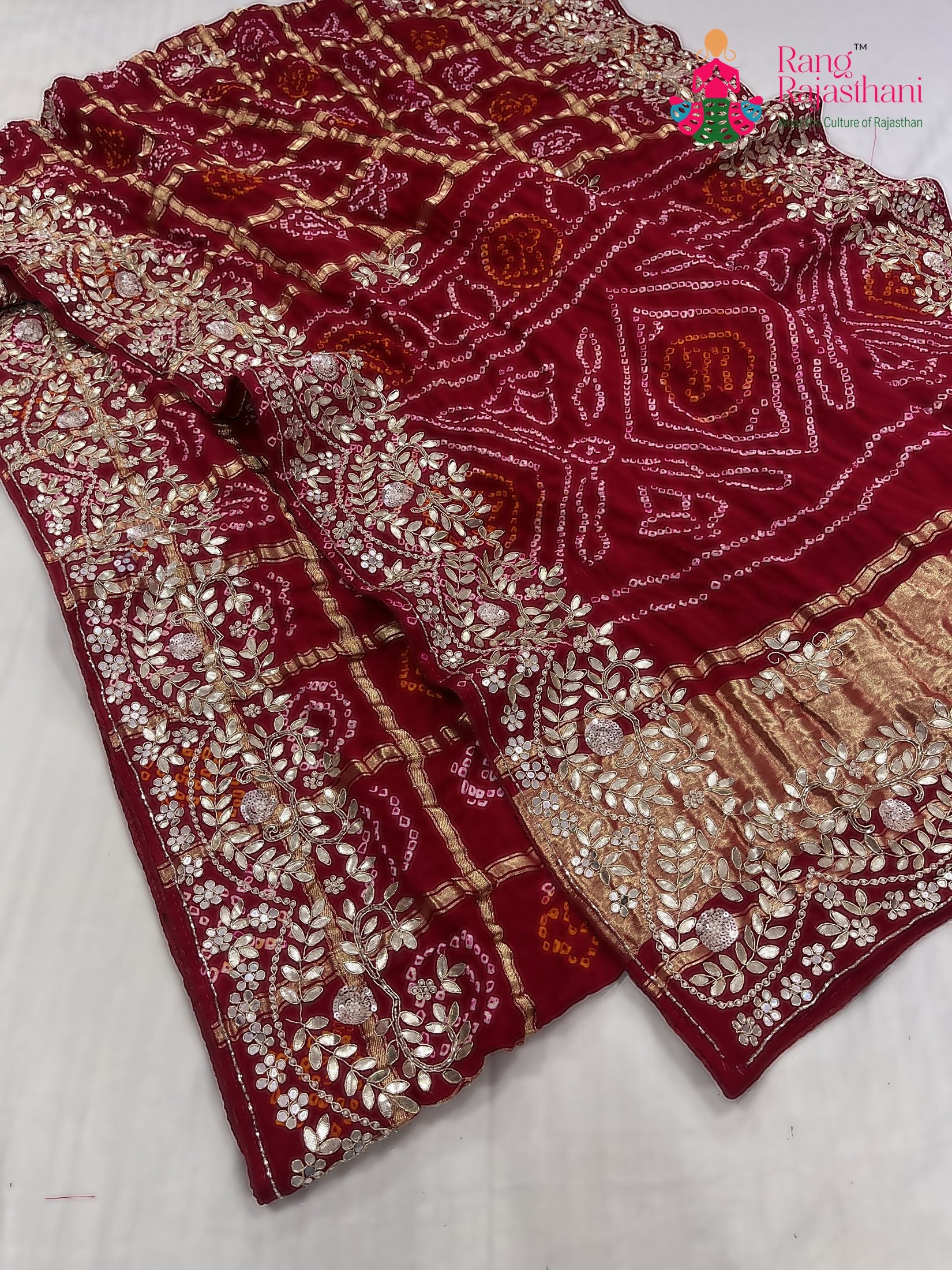close up detailing of red gajji silk hand embellishment saree