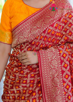 Red Silk saree with Banarasi Ghatchola and Bandhani close up detailing