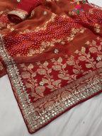 close up detailing of red khaddi gota patti saree 