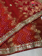 close up view of red khaddi gota patti saree