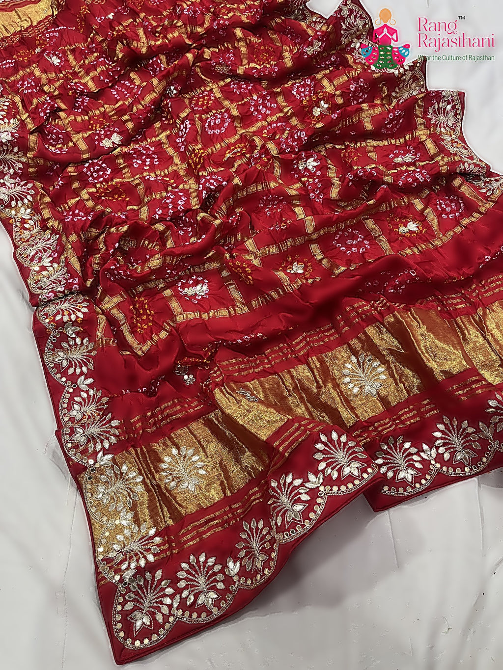 close up detailing of red khaddi gota patti saree 