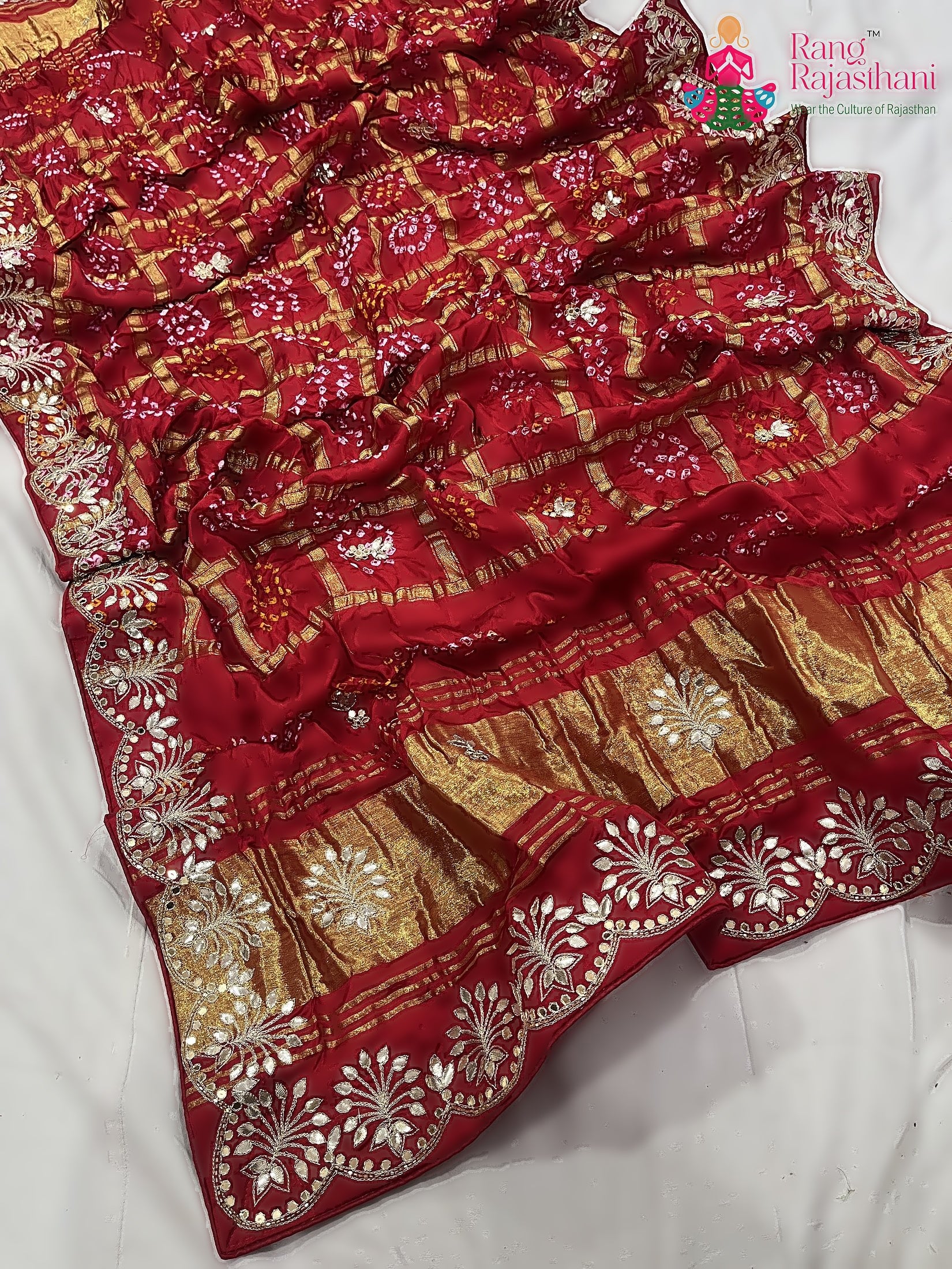 close up detailing of red khaddi gota patti saree 