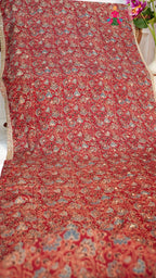 close up view of red modal ajrakh print saree