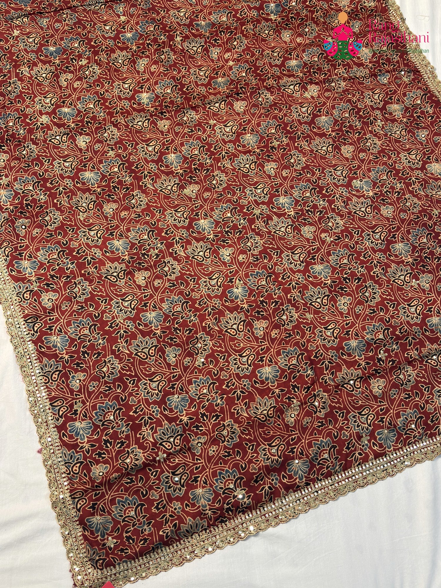 fabric texture of red modal ajrakh print saree