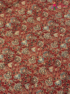 intricate detail of red modal ajrakh print saree