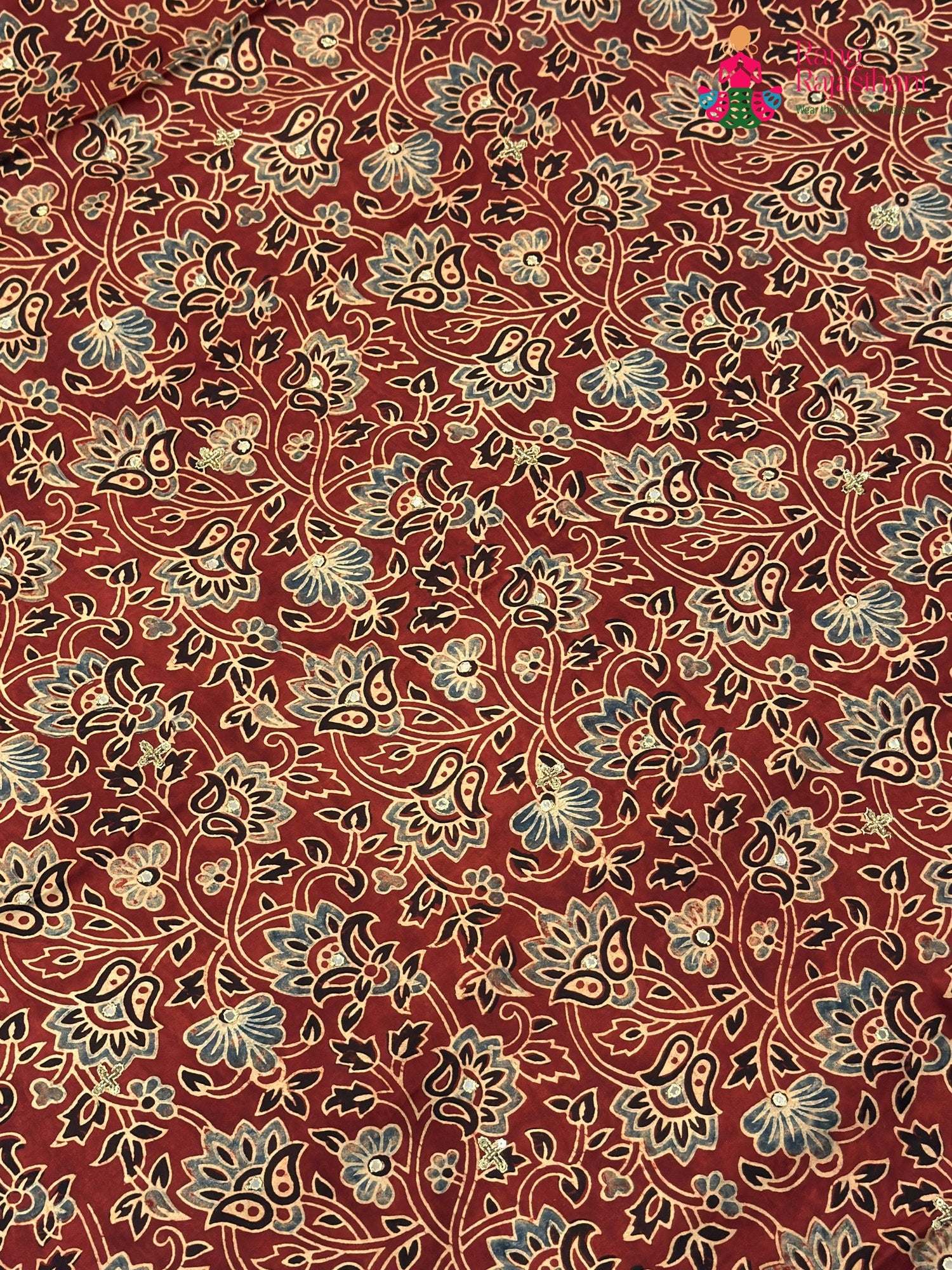 intricate detail of red modal ajrakh print saree