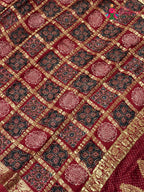 border detail of red modal banarasi zari weave gharchola saree