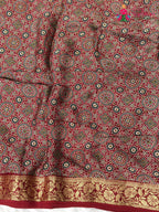 close up view of red modal banarasi zari weave gharchola saree
