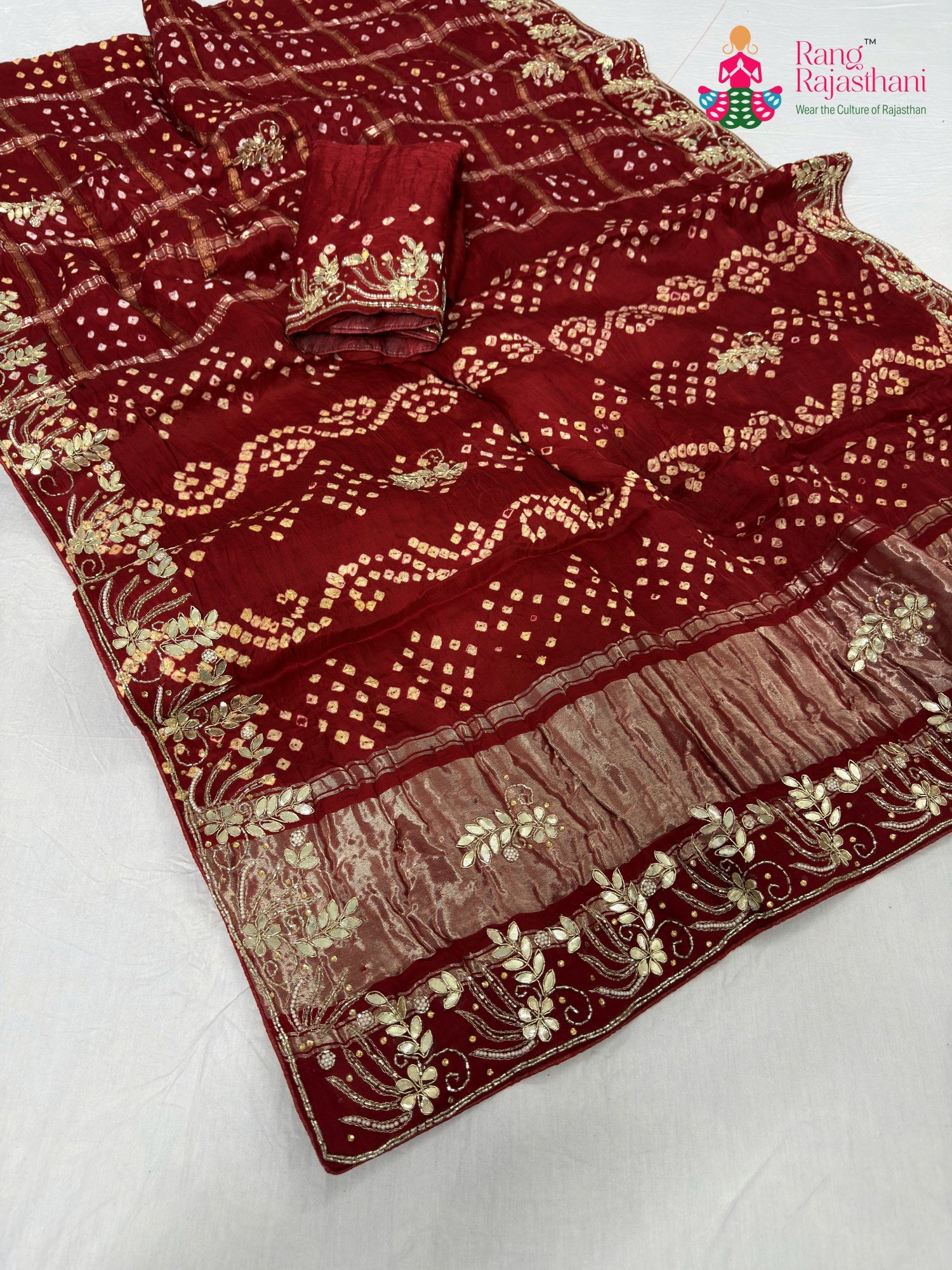 pallu detailing of red modal bandhani saree