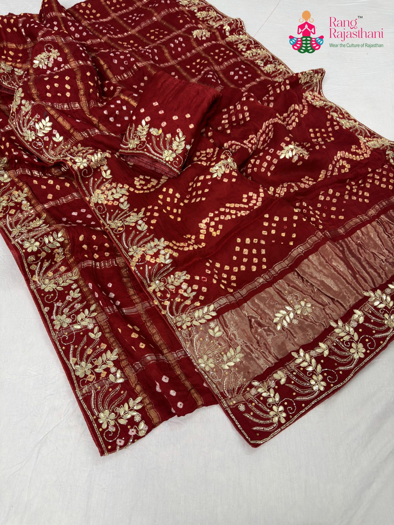 close up detailing of red modal bandhani saree