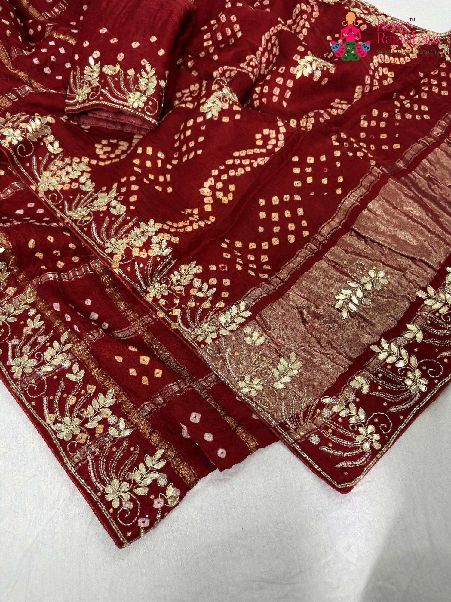 border detailing of red modal bandhani saree