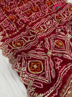 pallu detailing of red modal bandhani saree