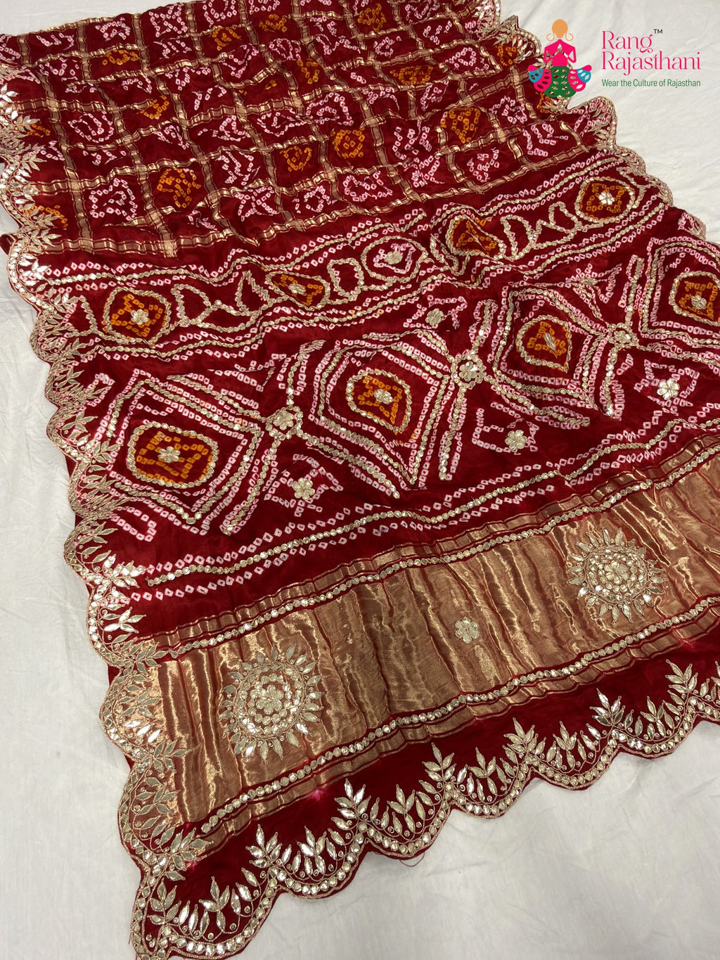 close up detailing of red modal bandhani saree