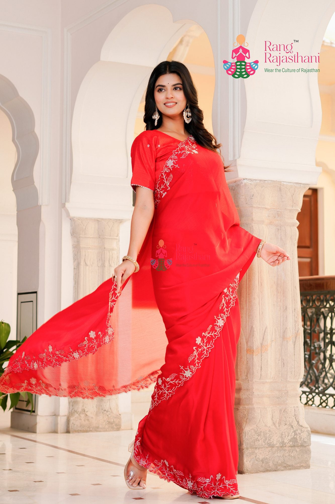 red synthetic chiffon saree with figure work for sister's side drape view