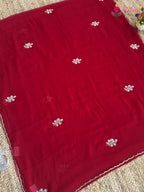 pallu detailing of red pure chiffon hand embellishment saree