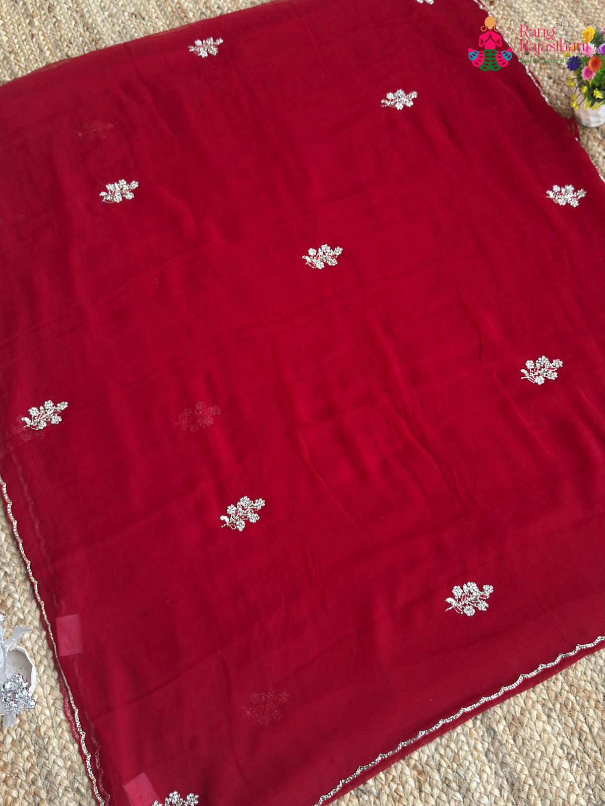 pallu detailing of red pure chiffon hand embellishment saree