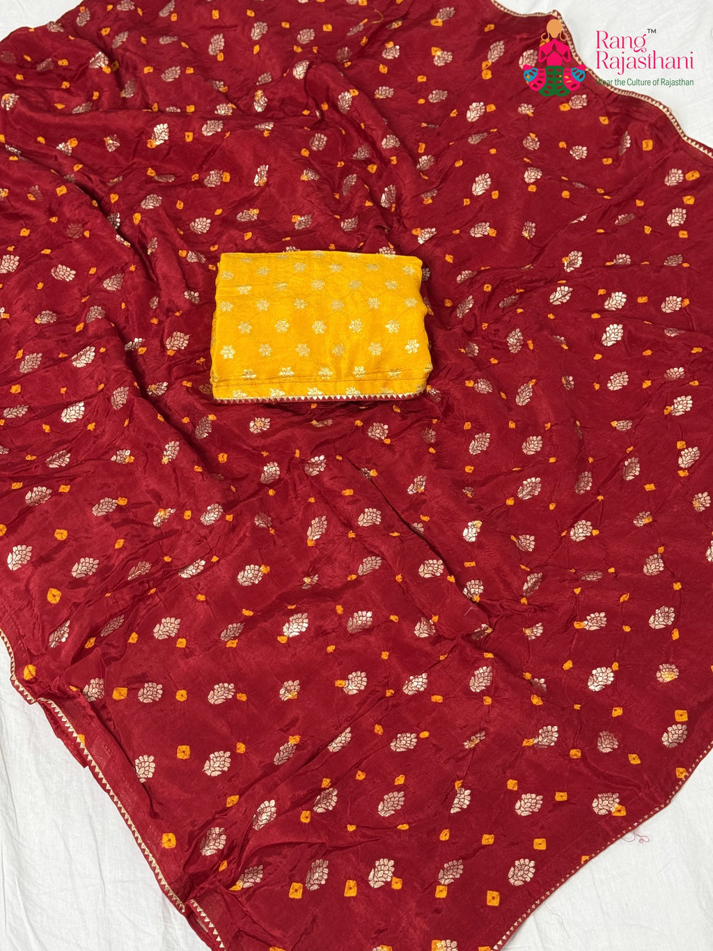 close up detailing of red pure dola silk bandhani saree