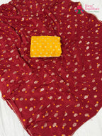 close up detailing of red pure dola silk bandhani saree