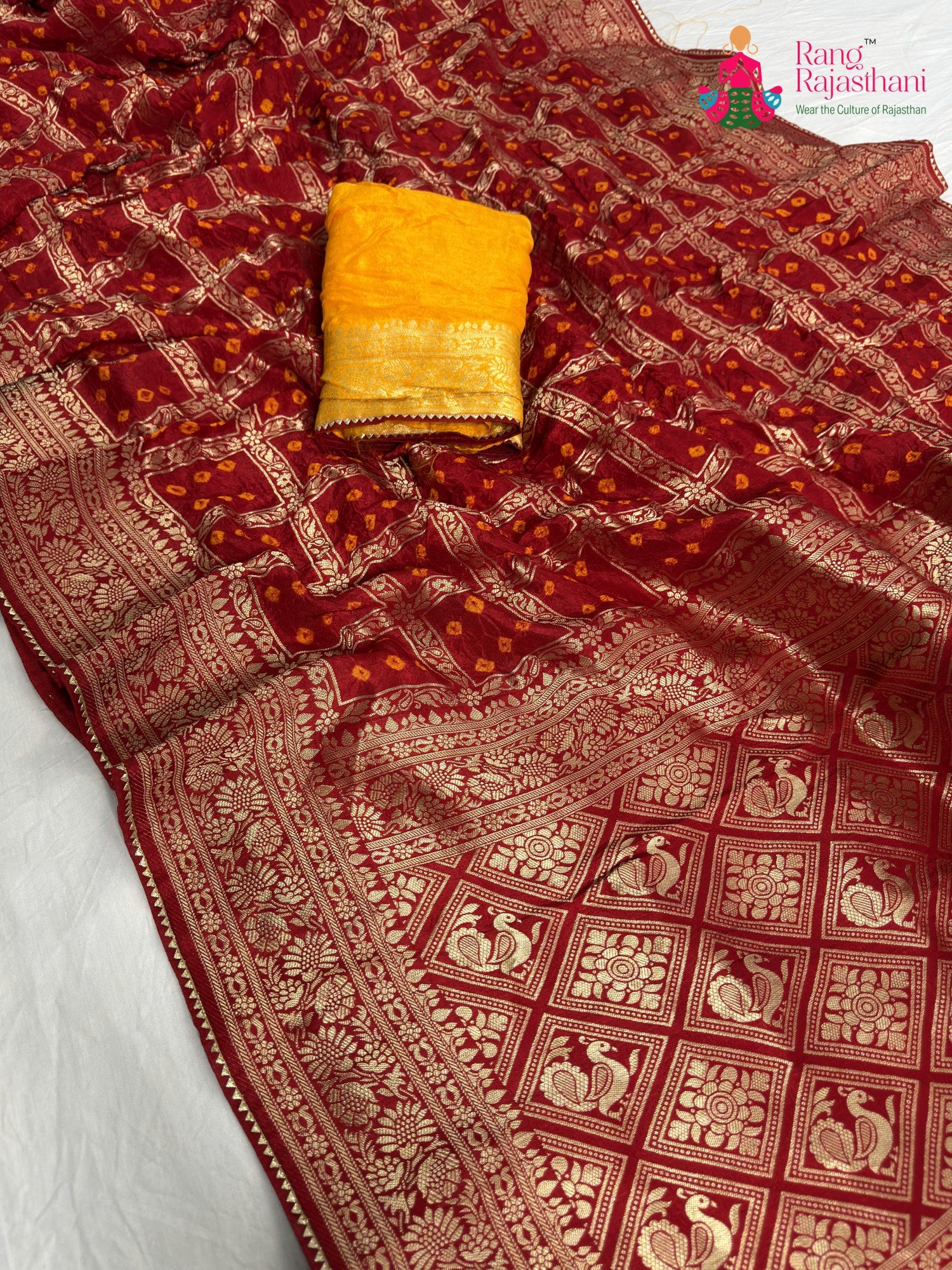 pallu detailing of red pure dola silk zari embroidery saree