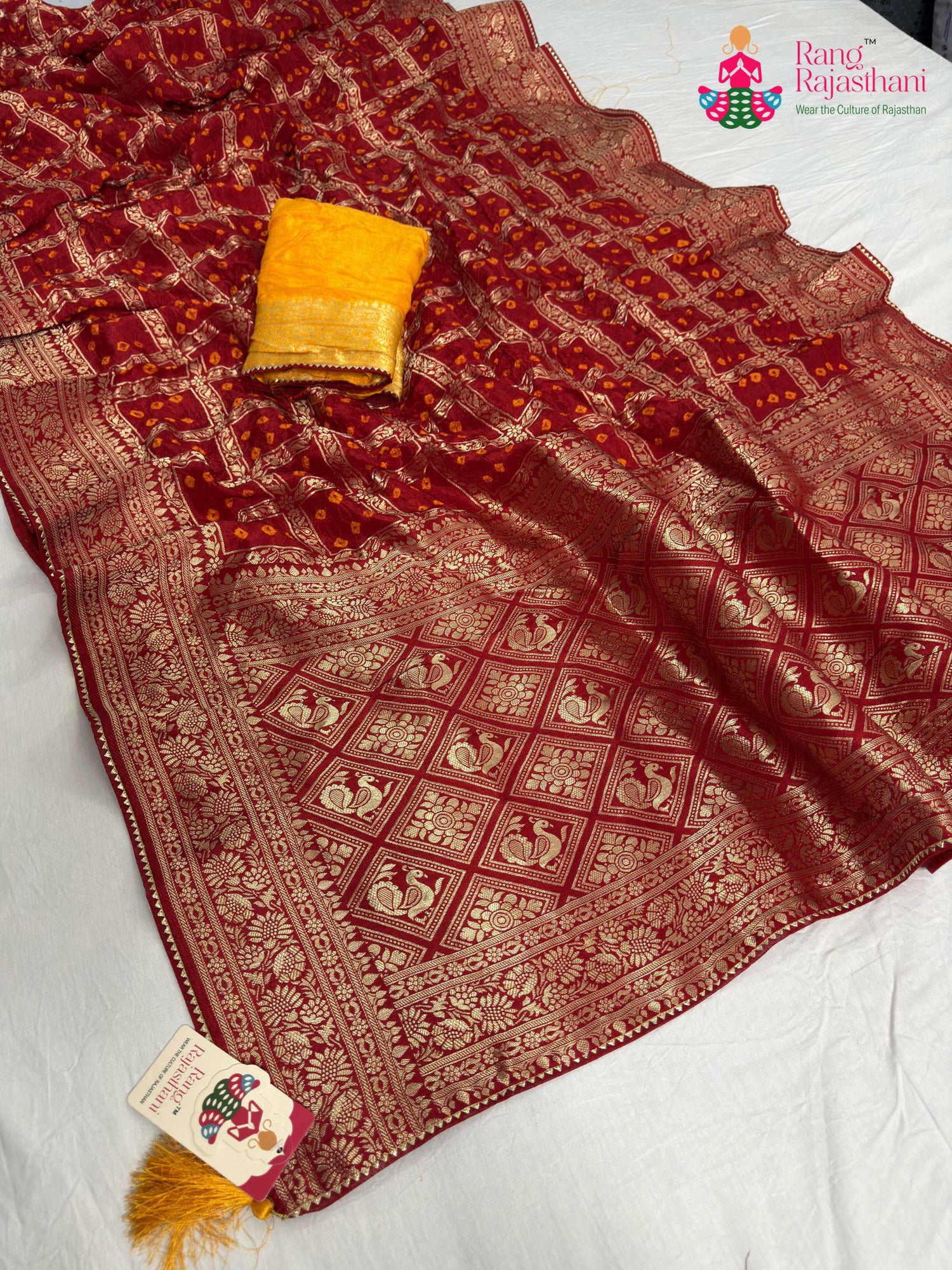 close up detailing of red pure dola silk zari embroidery saree