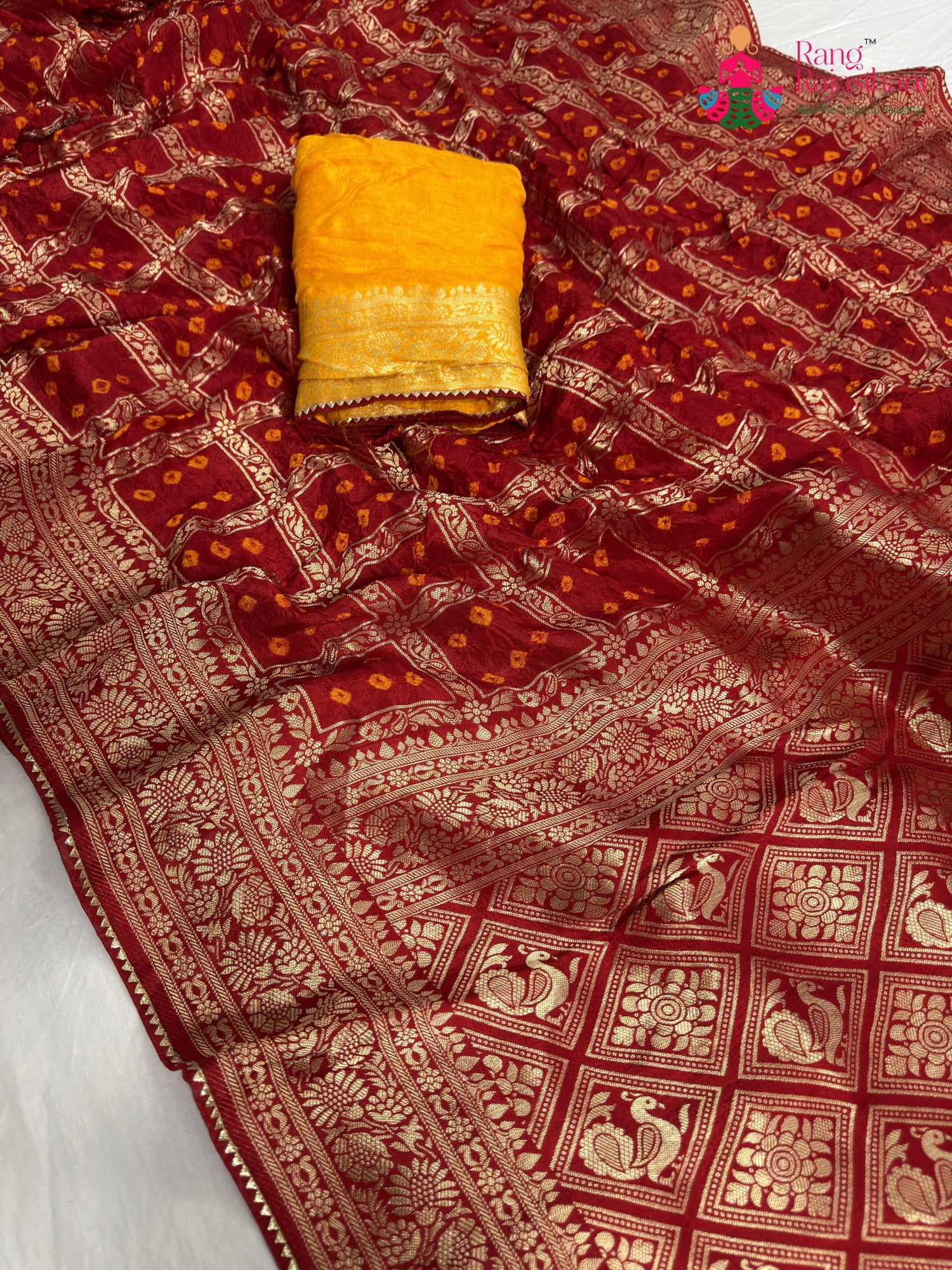 border detailing of red pure dola silk zari embroidery saree