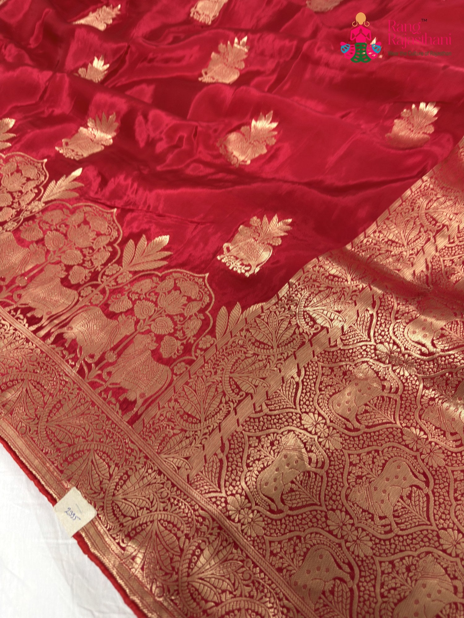 close up detailing of red pure ho silk banarasi zari weave saree