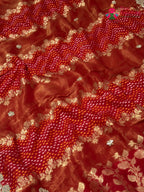border detail of red khaddi gota patti saree