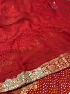 close up view of red khaddi gota patti saree