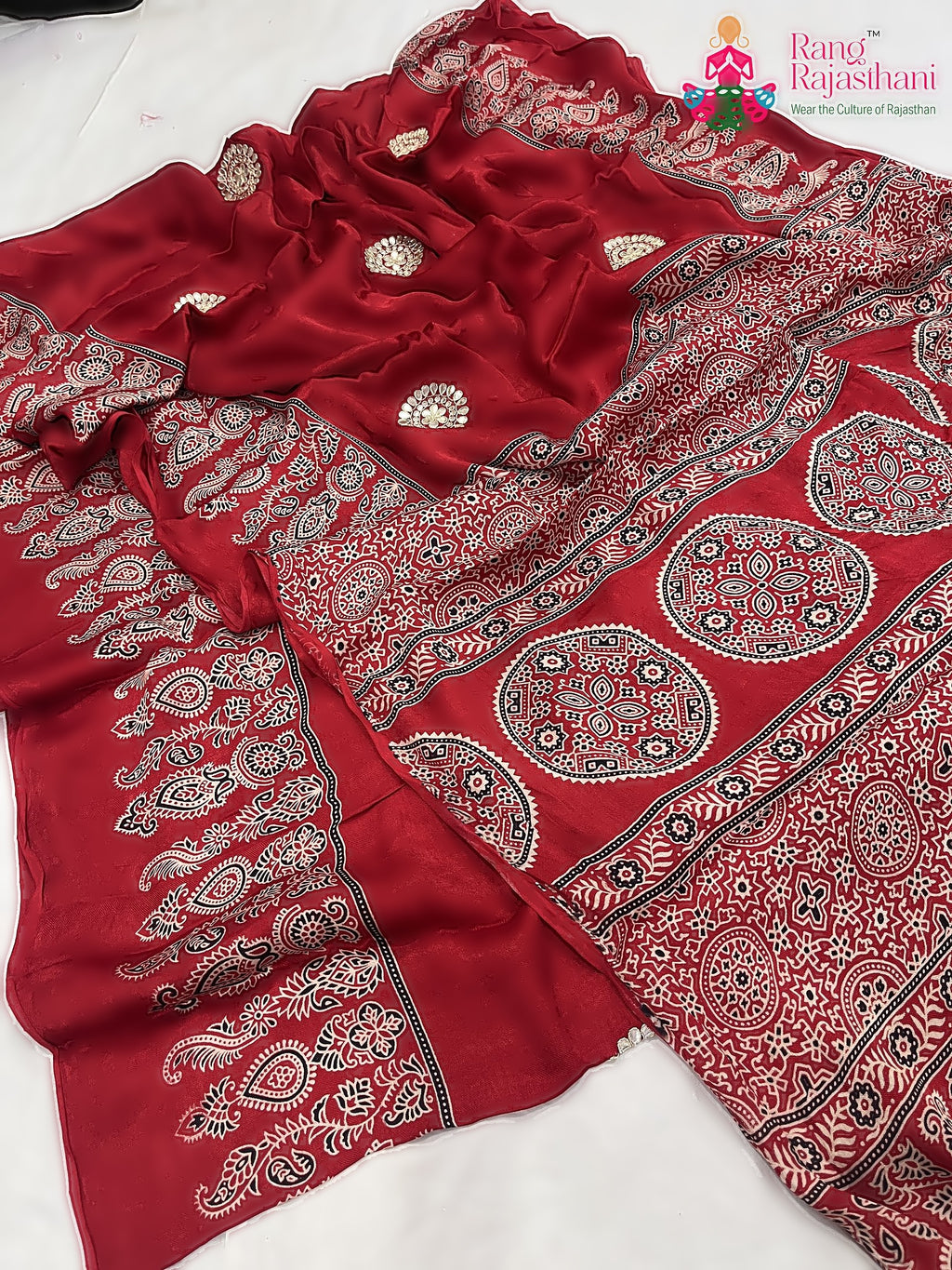 close up detailing of red pure modal silk ajrakh print saree 