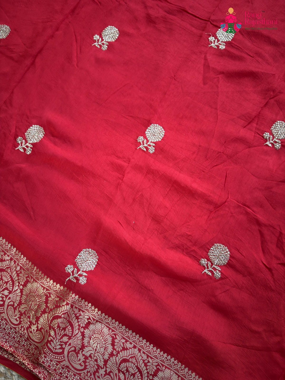 border detail of red pure russian silk zari embroidery saree