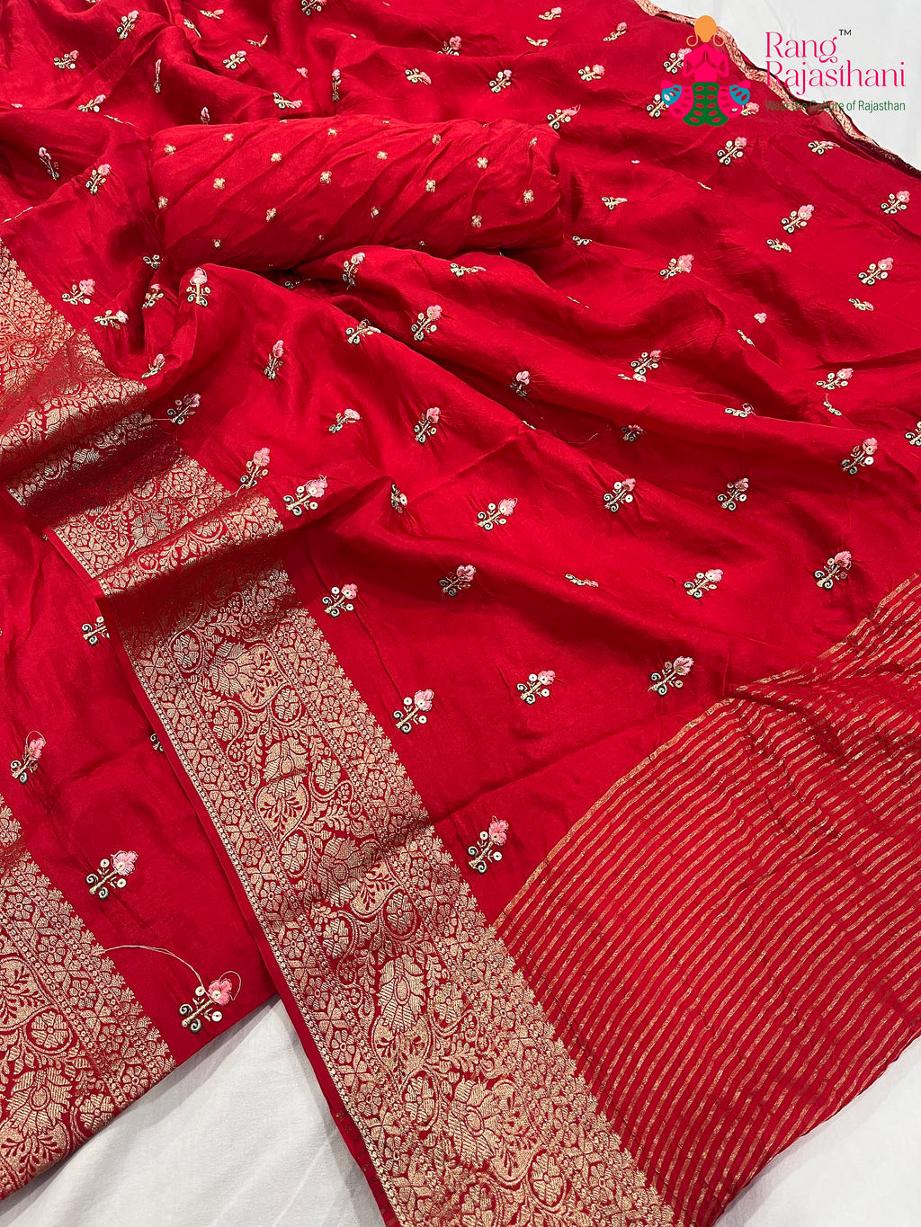 close up detailing of red pure Russian silk resham embroidery saree 