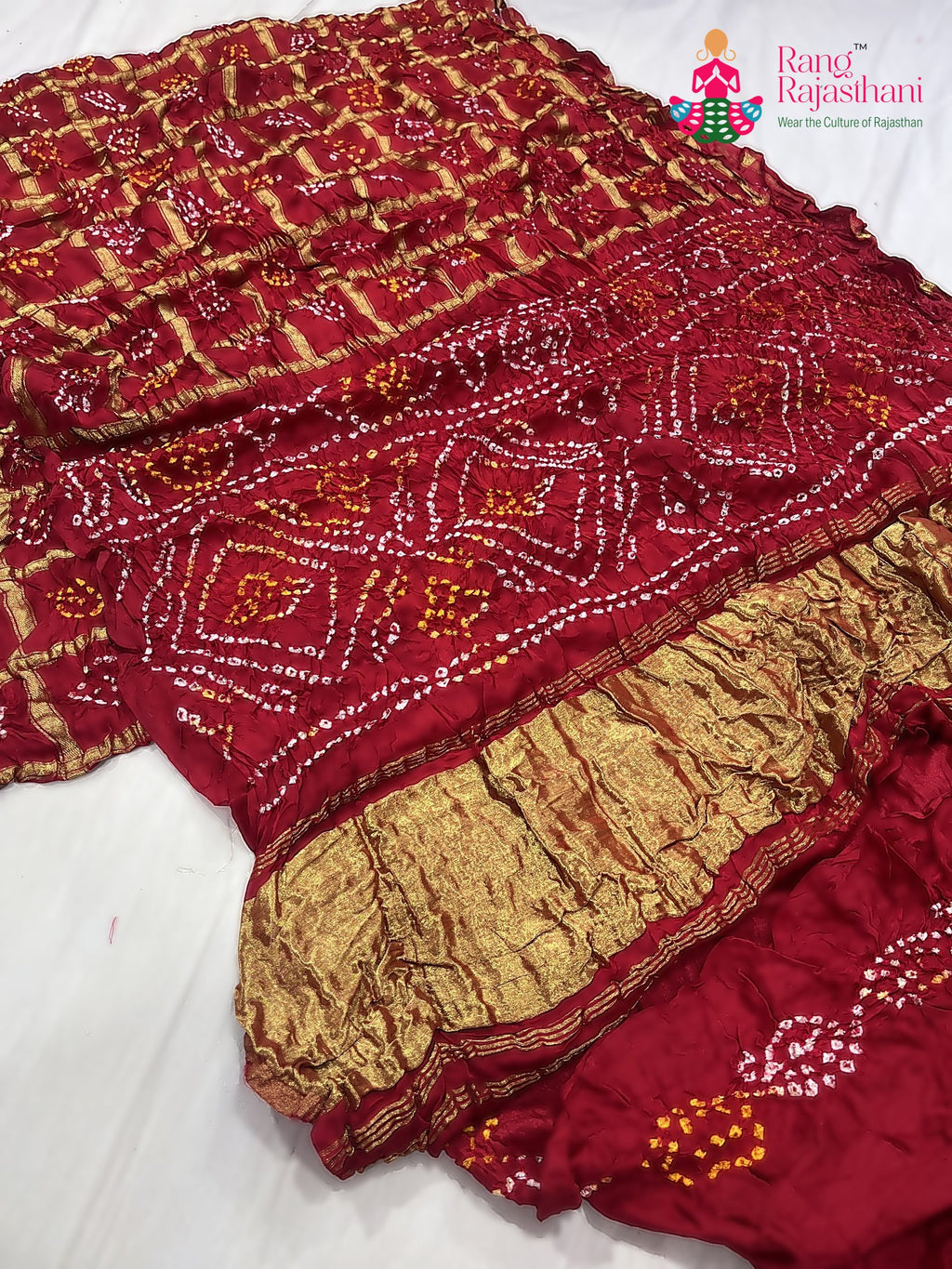 close up detailing of red russian silk bandhani gharchola saree 