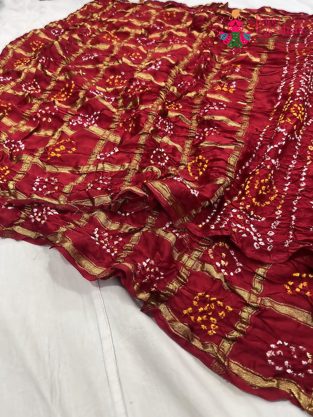 pallu detailing of red russian silk bandhani gharchola saree 