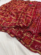 pallu detailing of red russian silk bandhani gharchola saree 
