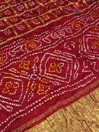 pallu detailing of red russian silk bandhani gharchola saree