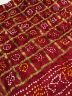 border detail of red russian silk bandhani gharchola saree