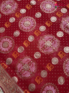 pallu detailing of red soft georgette banarasi zari weave gharchola saree