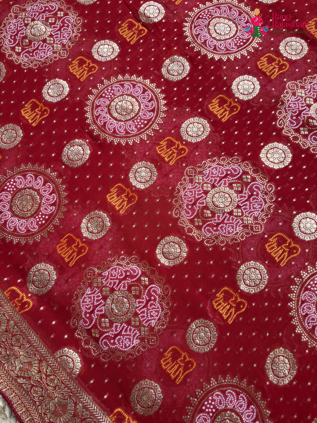 pallu detailing of red soft georgette banarasi zari weave gharchola saree