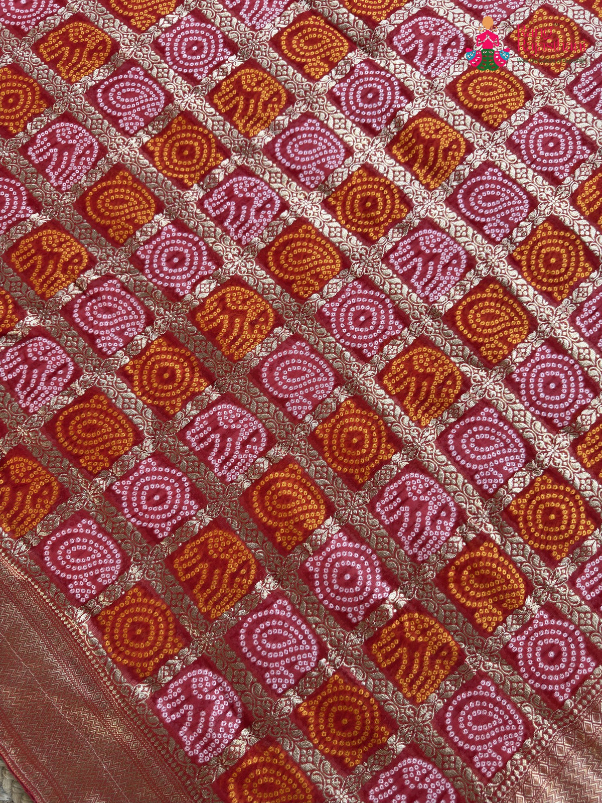 pallu detailing of red soft georgette banarasi zari weave gharchola saree