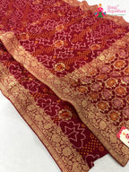 border detailing of red soft georgette bandhani saree