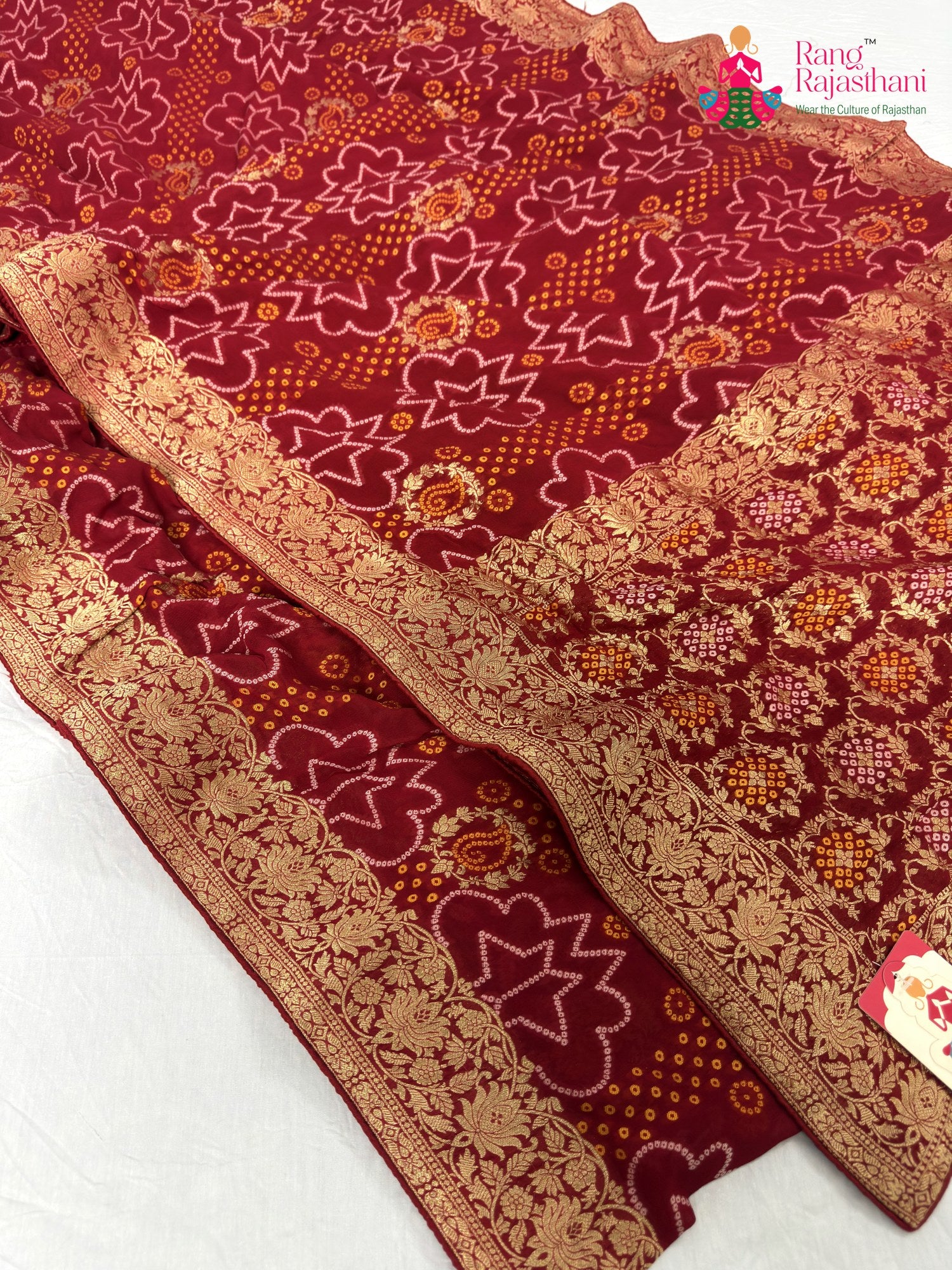 border detailing of red soft georgette bandhani saree
