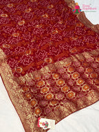 pallu detailing of red soft georgette bandhani saree