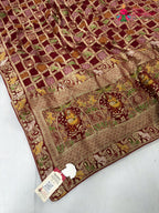 pallu detailing of red soft georgette bandhani saree
